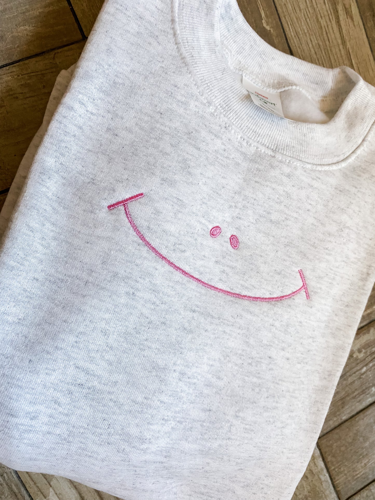 Embroidered Happy Face Sweatshirt