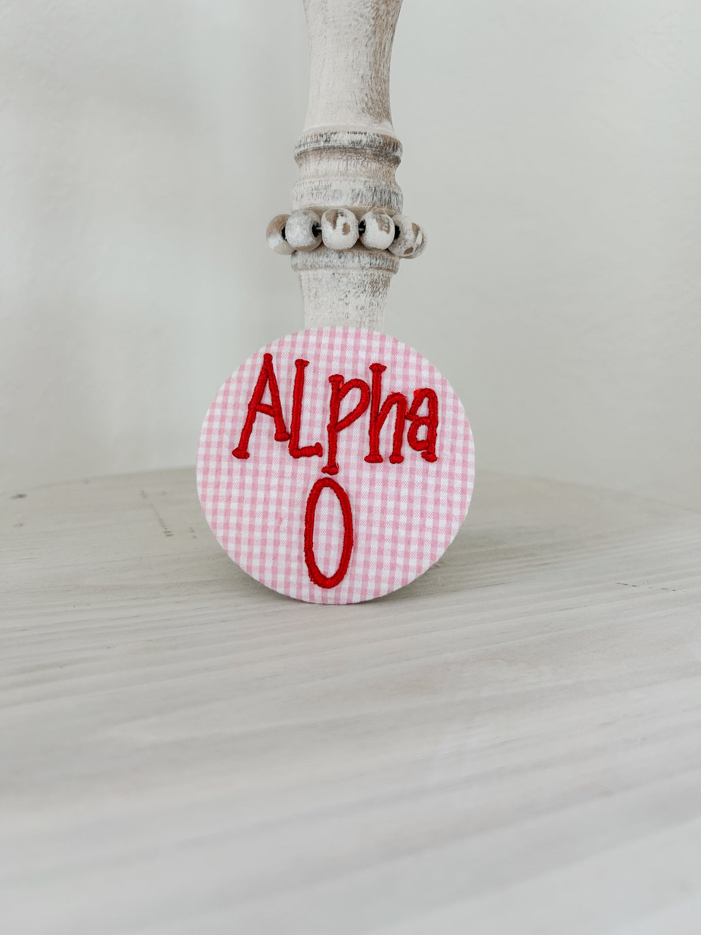Alpha O Embroidered Button