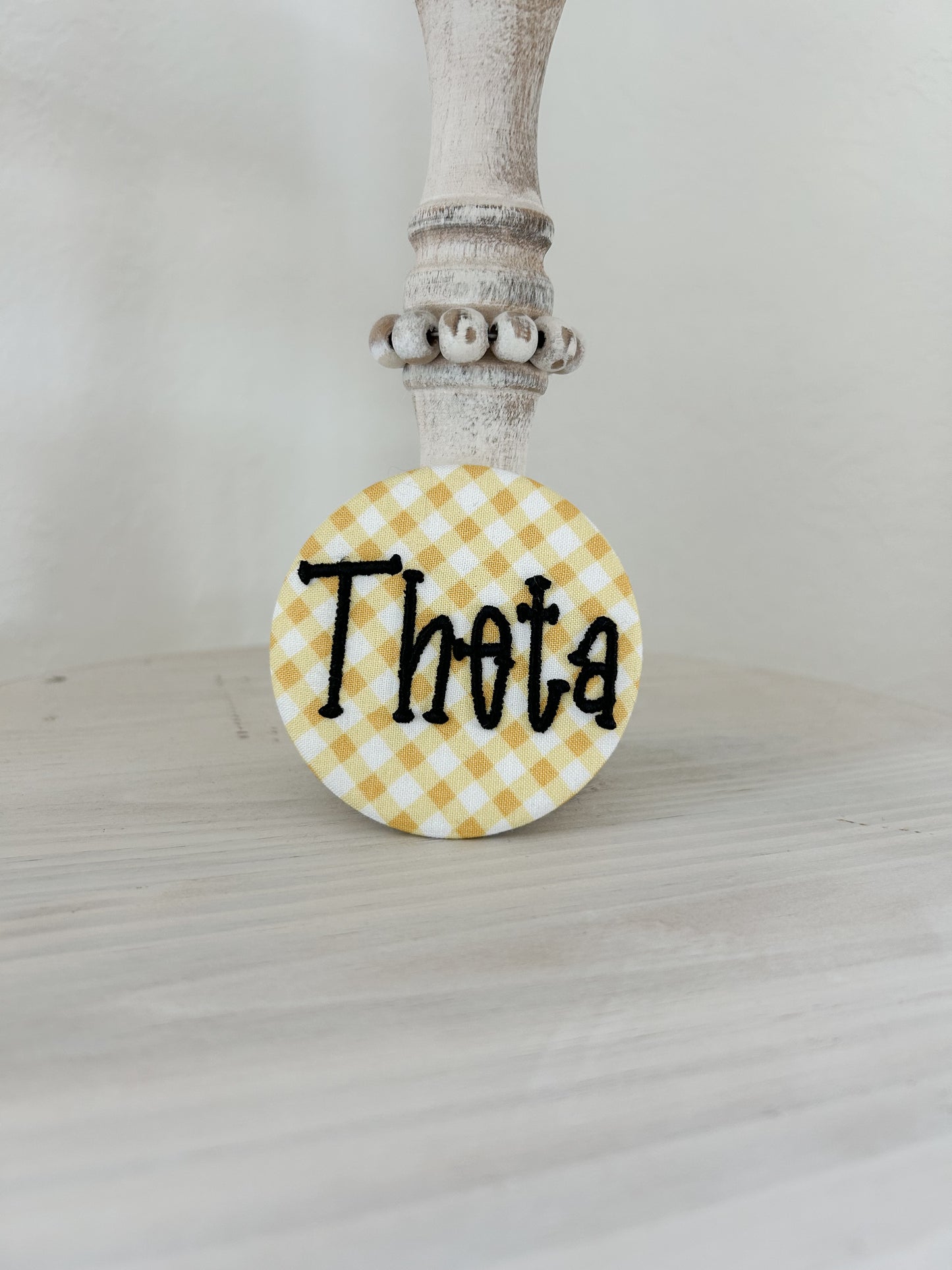Theta Embroidered Button