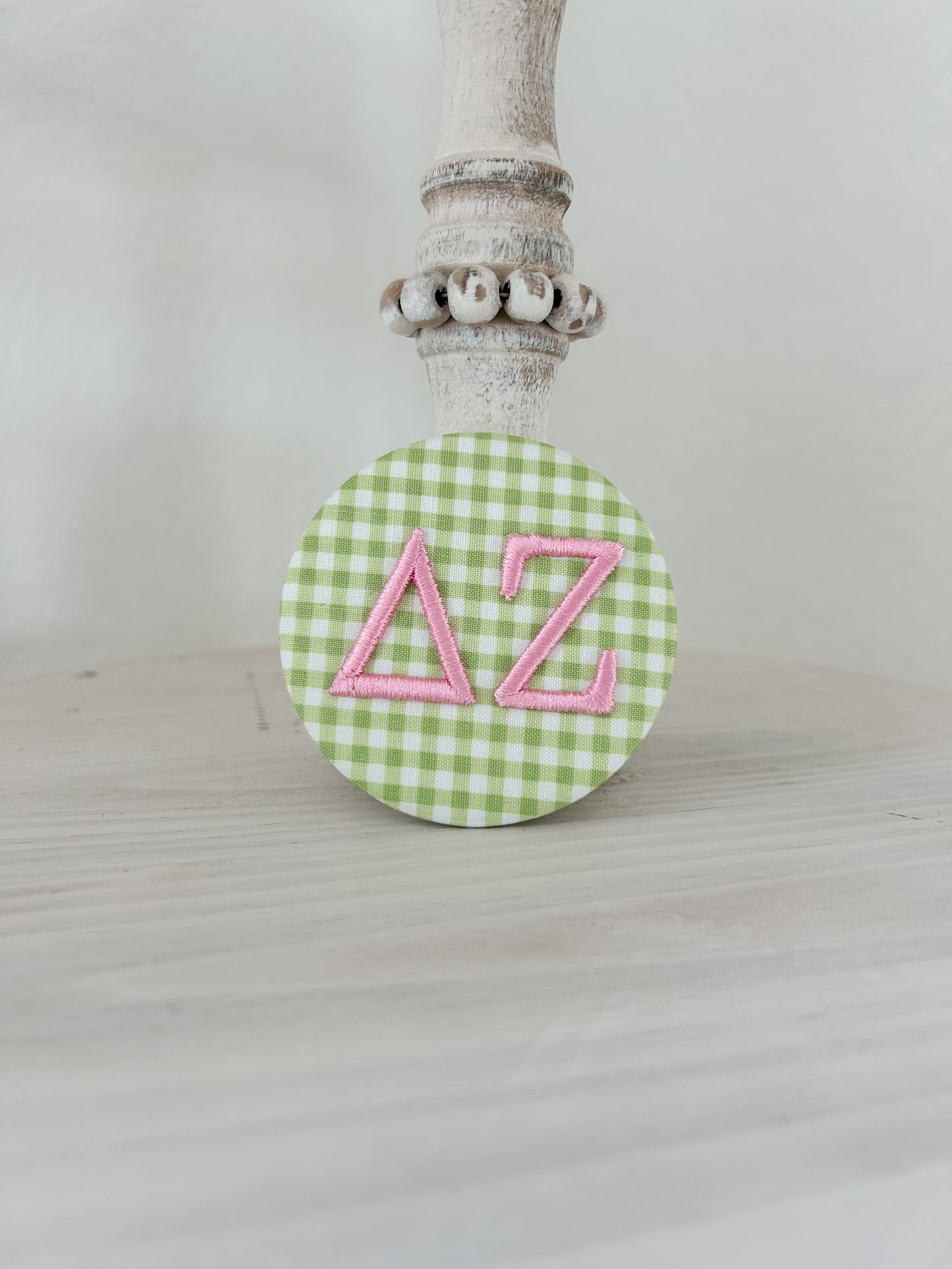 ∆Z Embroidered Button