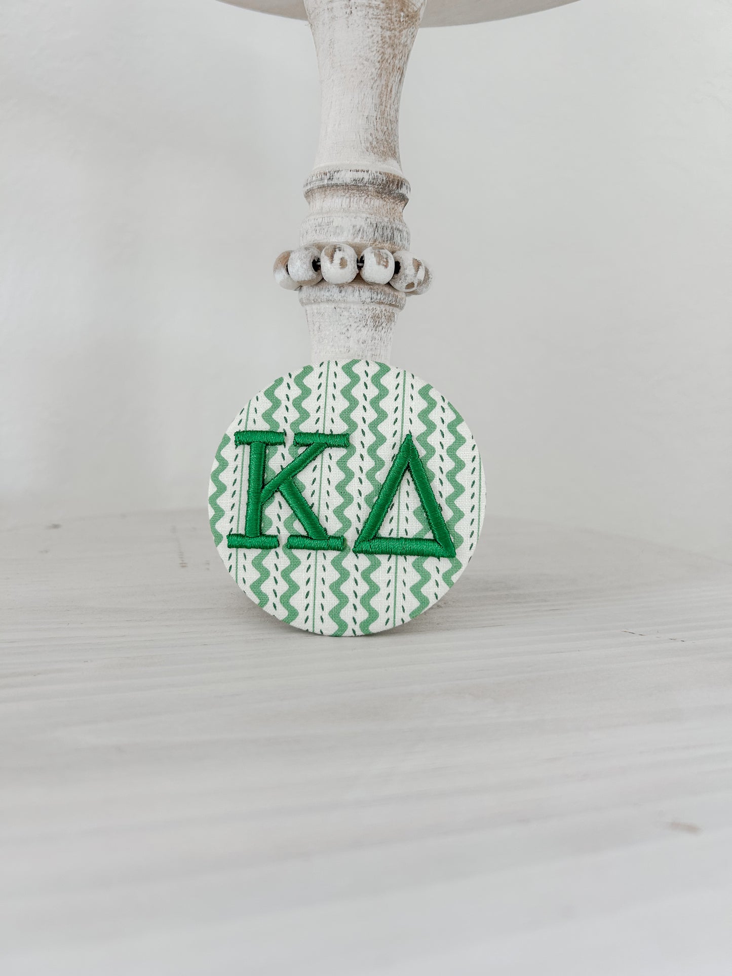 K∆ Embroidered Button