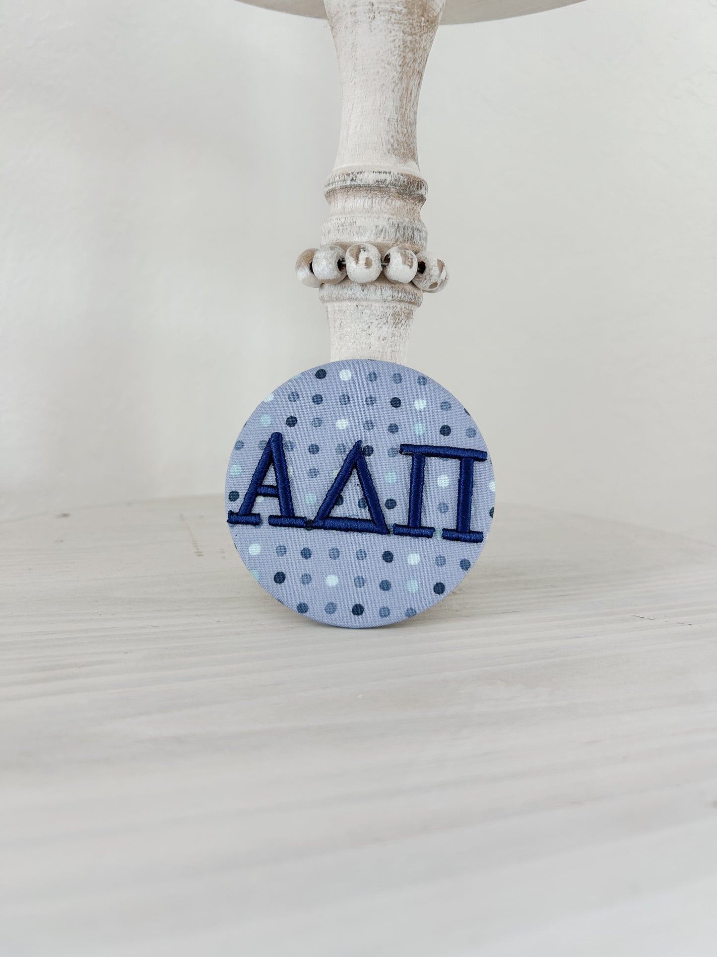A∆π Embroidered Button